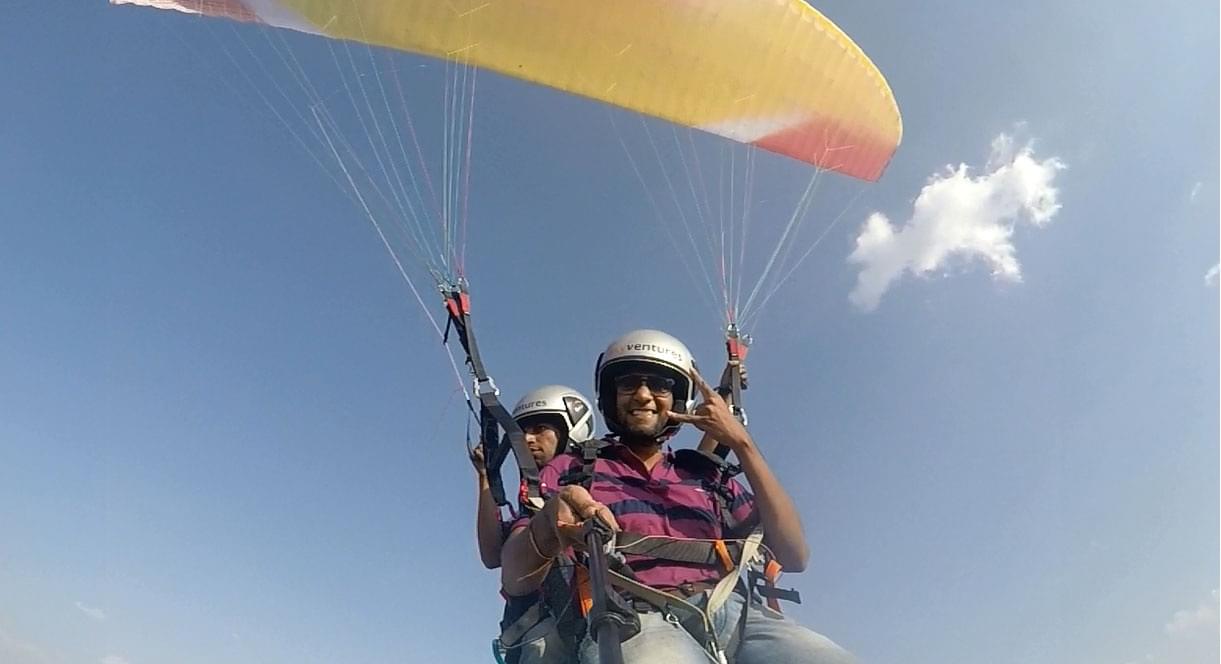 A paragliding selfie taken from a GoPro on a long selfie stick with remote  control. I'