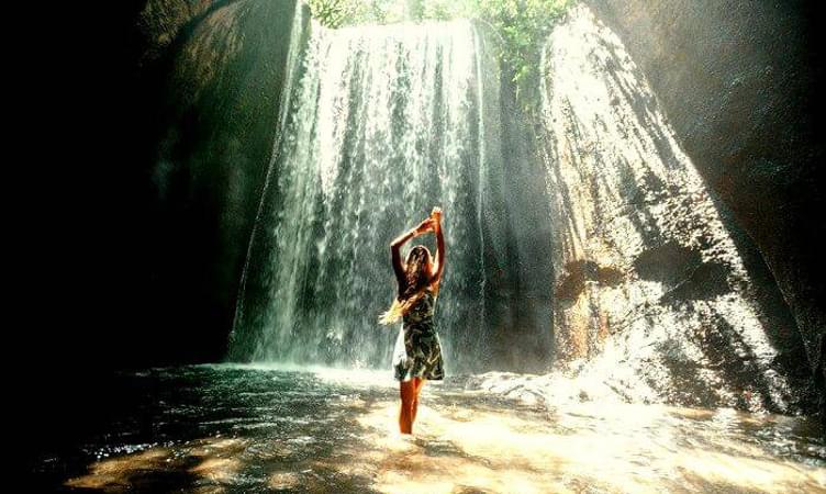 Visit Tukad Cepung Waterfall